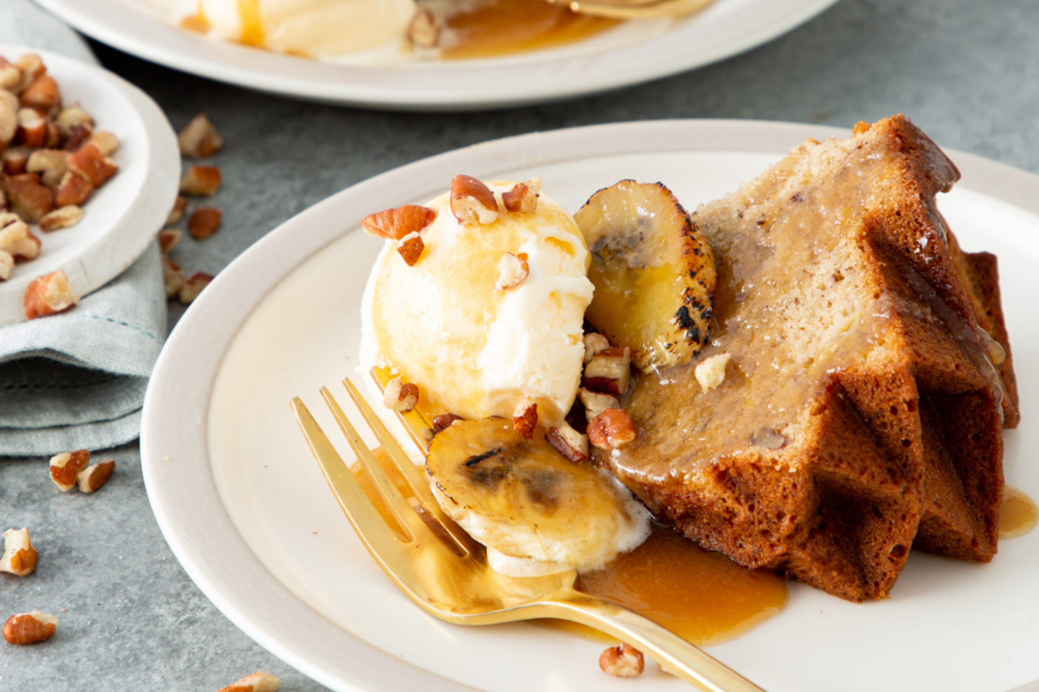 Slice of Bananas Foster Bundt Cake created by Bake From Scratch magazine as part of the Bundt of the Month recipe collection.