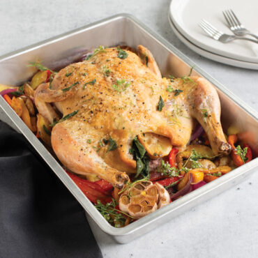Roasted Turkey inside pan with veggies