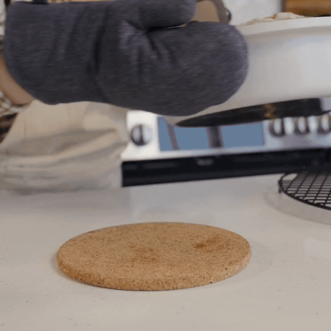 GIF image of taking sourdough bread in pan out of the oven