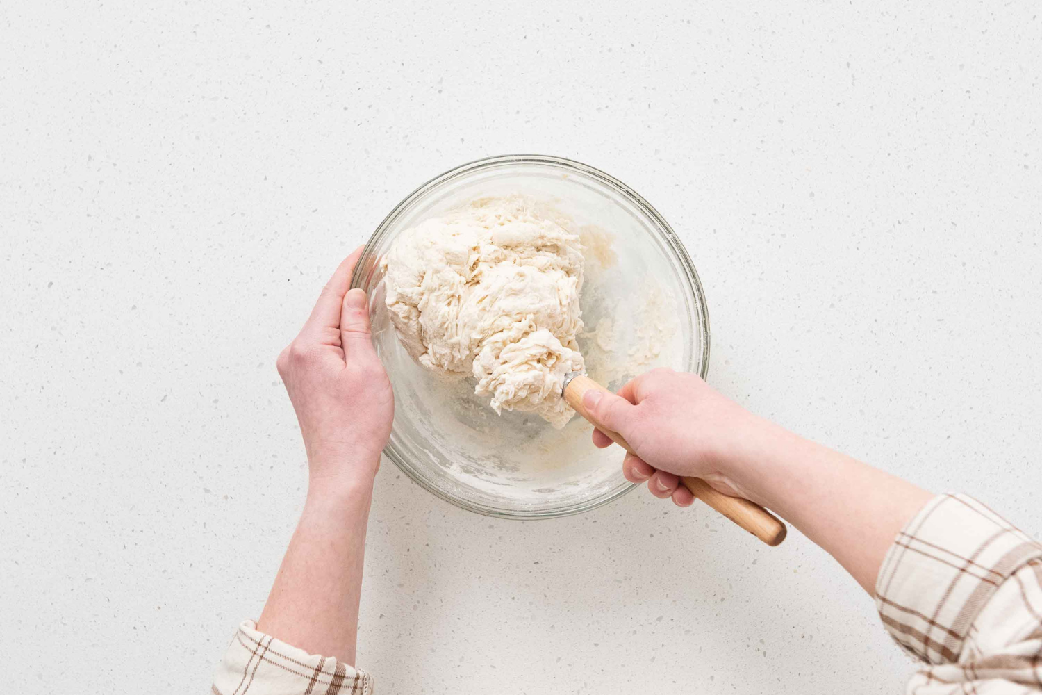 Mixing dough with the Danish Dough Whisk from the Simply Sourdough Bread Baking Kit.