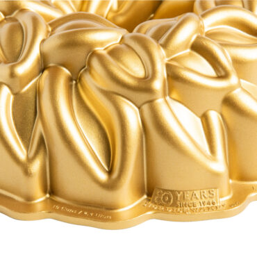 Laurel Wreath Bundt Pan with gold exterior, closeup of