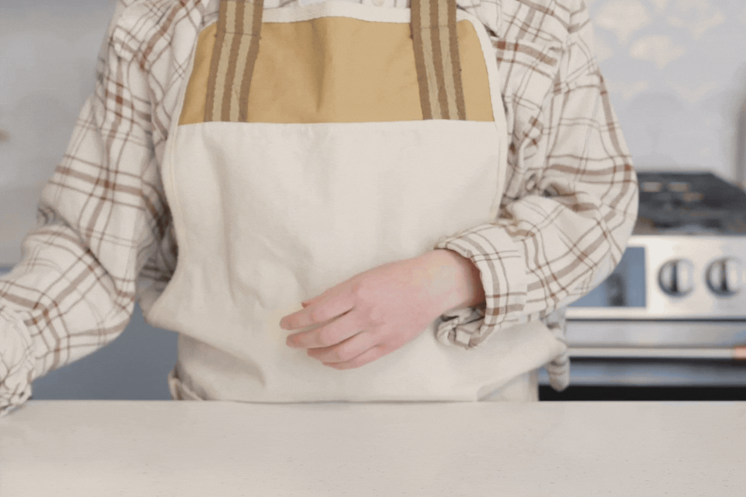 Gif of a baker scoring a sourdough bread loaf using the Retractable Bread Lame from the Simply Sourdough Bread Baking Kit. 