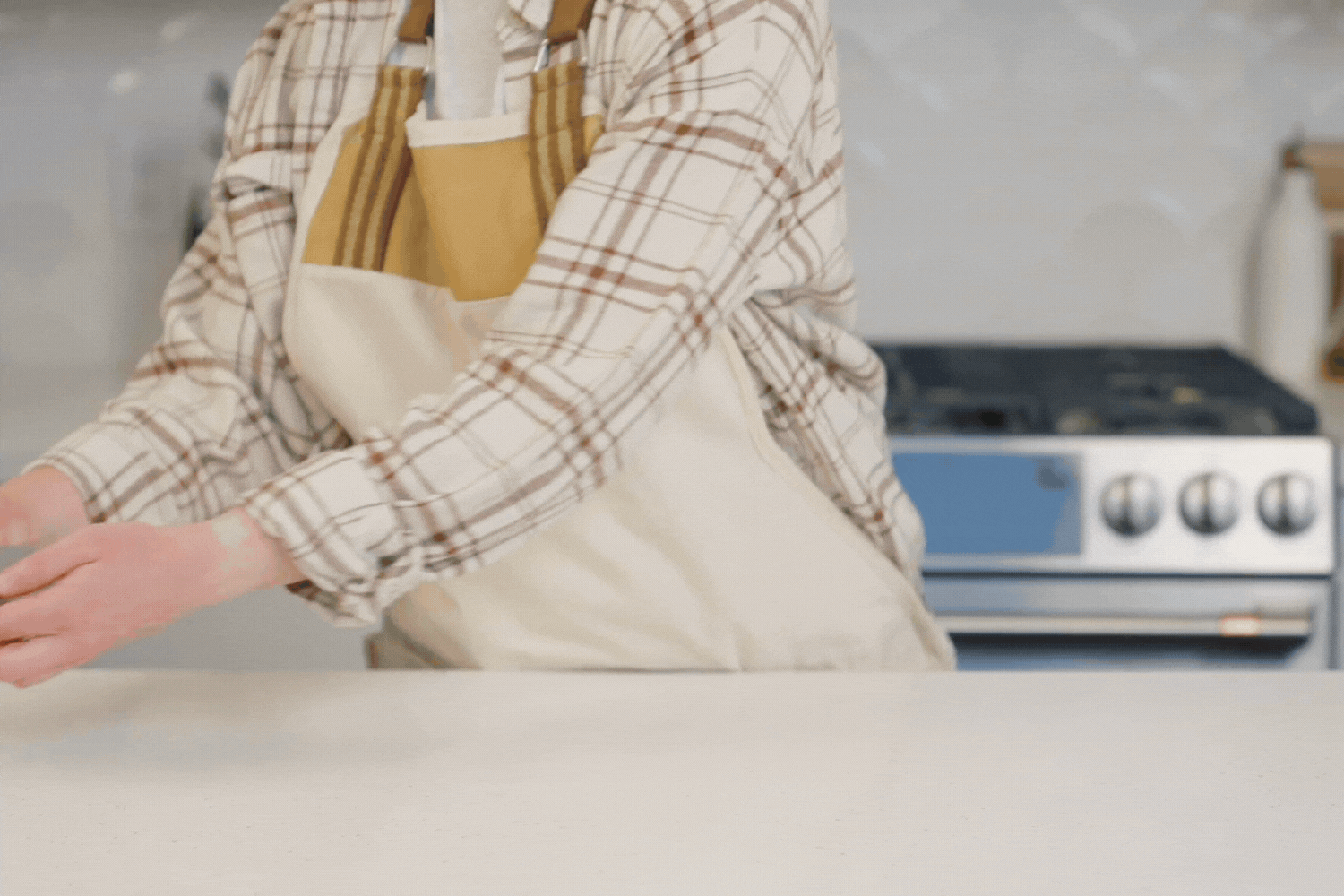 Gif of baker measuring ingredients for sourdough bread on Escali Digital Baking Scale from the Deluxe 10 Piece Simply Sourdough Bread Baking Kit. 