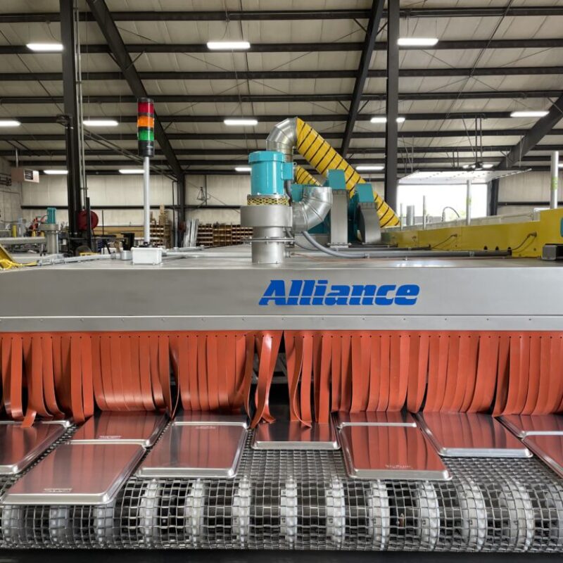 Image of washer machine with sheet pans in Nordic Ware Factory