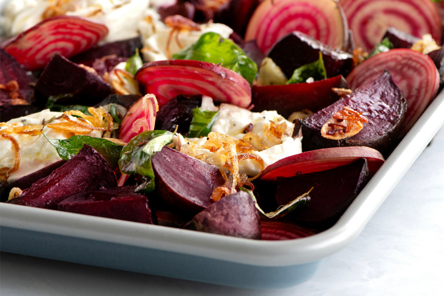 Brilliant Bakeware Nonstick Quarter Sheet Pan with roasted vegetables. 
