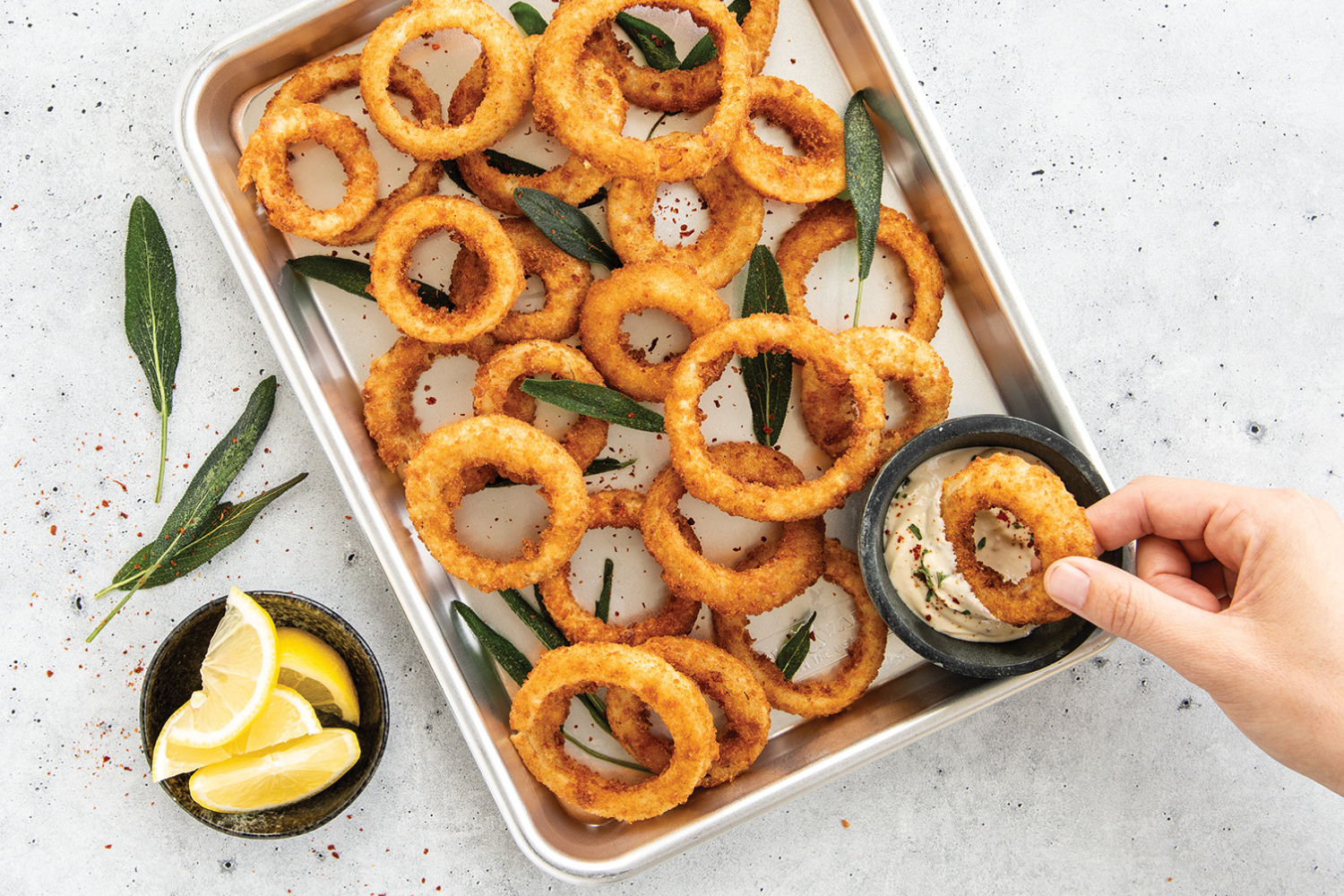 Onion rings served on a Naturals® Baker's Quarter Sheet Pan