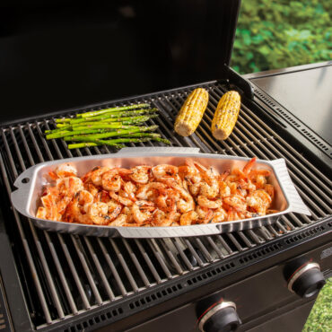 naturals fish and seafood griller on grill with shrimp, corn cobs and asparagus