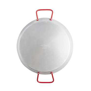 overhead view of exterior of aluminum paella pan with two red side handles, wide shallow circular design, natural silver finish