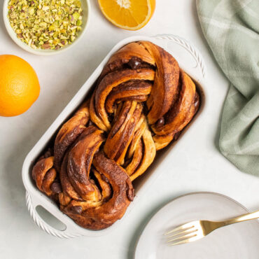 overhead view of golden babka bread with swirled filling baked in cardamom loaf pan