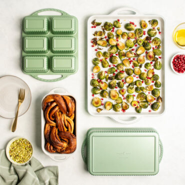 cardamom bakeware overhead lifestyle shot with brussel sprouts in baking sheet pan, and twisted loaf bread