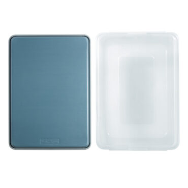 overhead of blue exterior of brilliant big sheet with lid next to it on white background