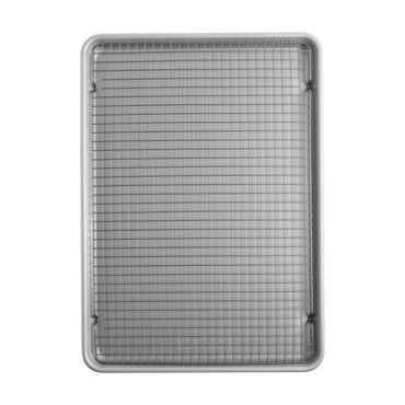 overhead of brilliant big sheet pan with cooling rack on white background