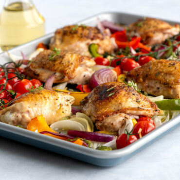 brilliant half sheet with baked chicken and veggies