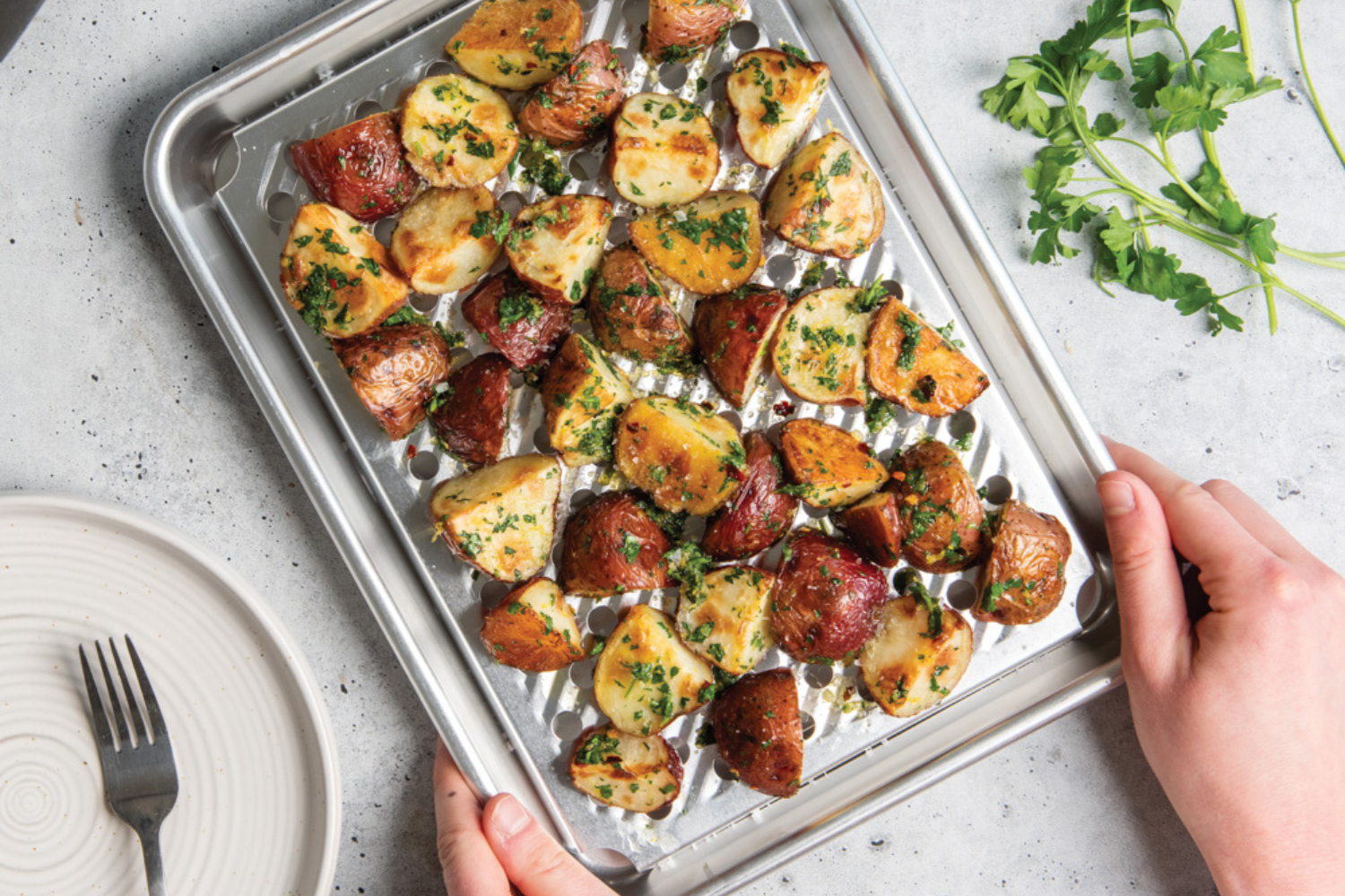 Roasted potatoes on Nordic Ware Naturals® Quarter Sheet with Multi-Task Oven & Cooling Rack
