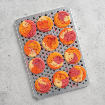 overhead of multi purpose rack with color swirl cookies