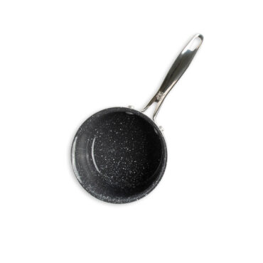 overhead of basalt 1.5qt saucepan showing speckled ceramic interior coating on white background