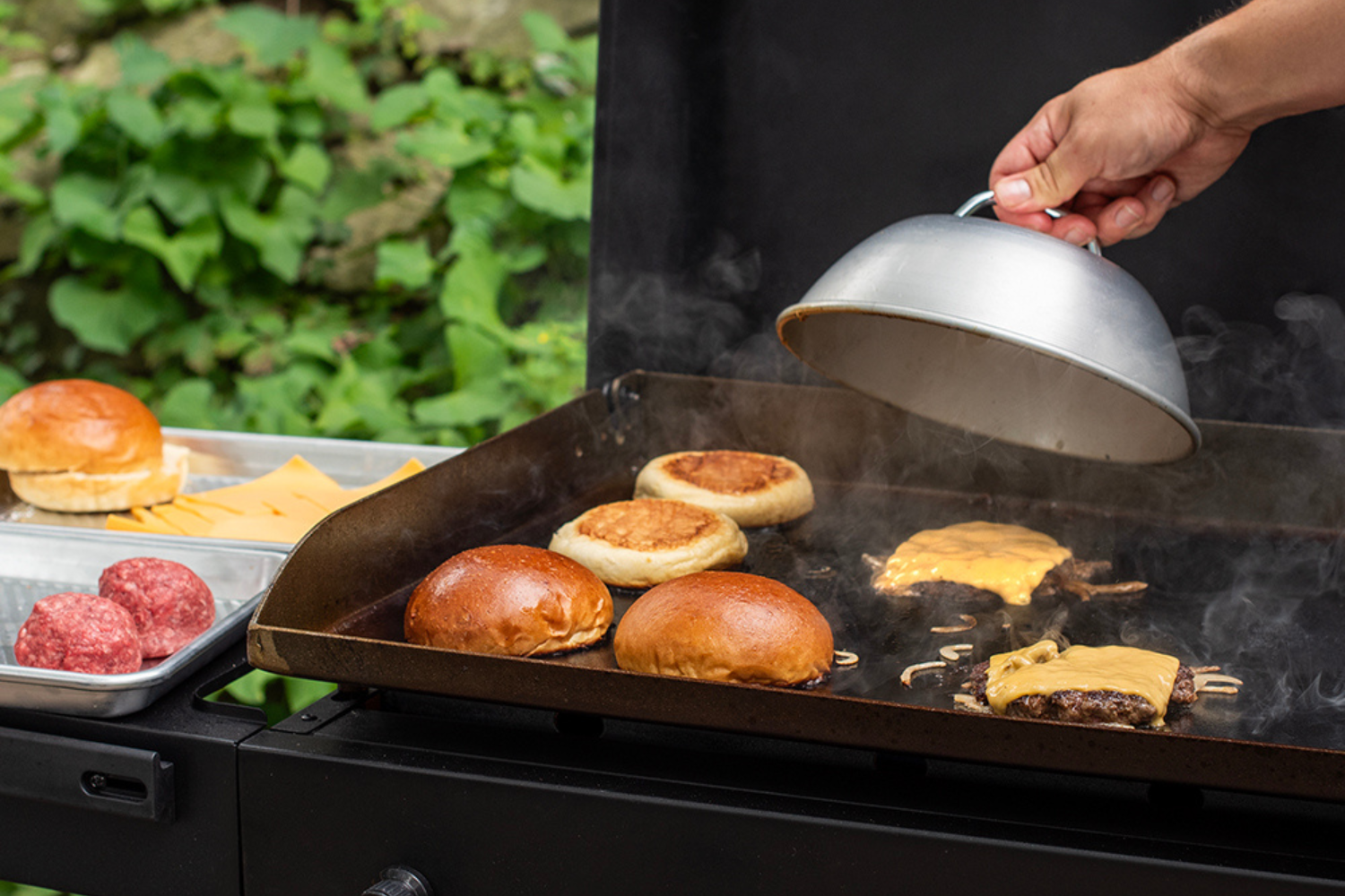 Melting cheese on a smash burger using the Nordic Ware Cheese Melting Dome