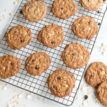 Golden baked chocolate chip cookies cooling on Nordic Ware nonstick grid rack