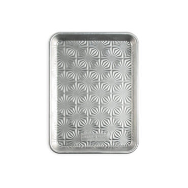 overhead of vintage staruburst quarter sheet pan on white background