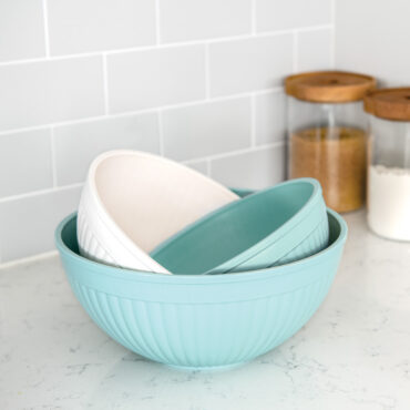 3 piece prep and serve mixing bowl set staged on countertop nested into each other