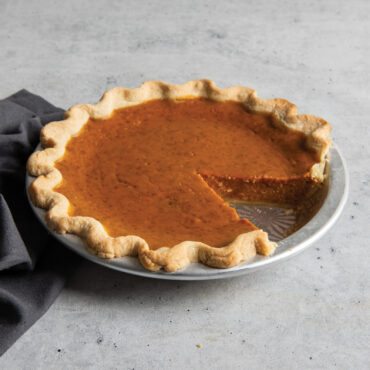 cut pumpkin pie inside nordic ware vintage starburst pie pan