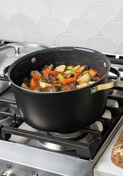 Image of 6 Qt Dutch Oven on the stovetop with cooked pasta meal