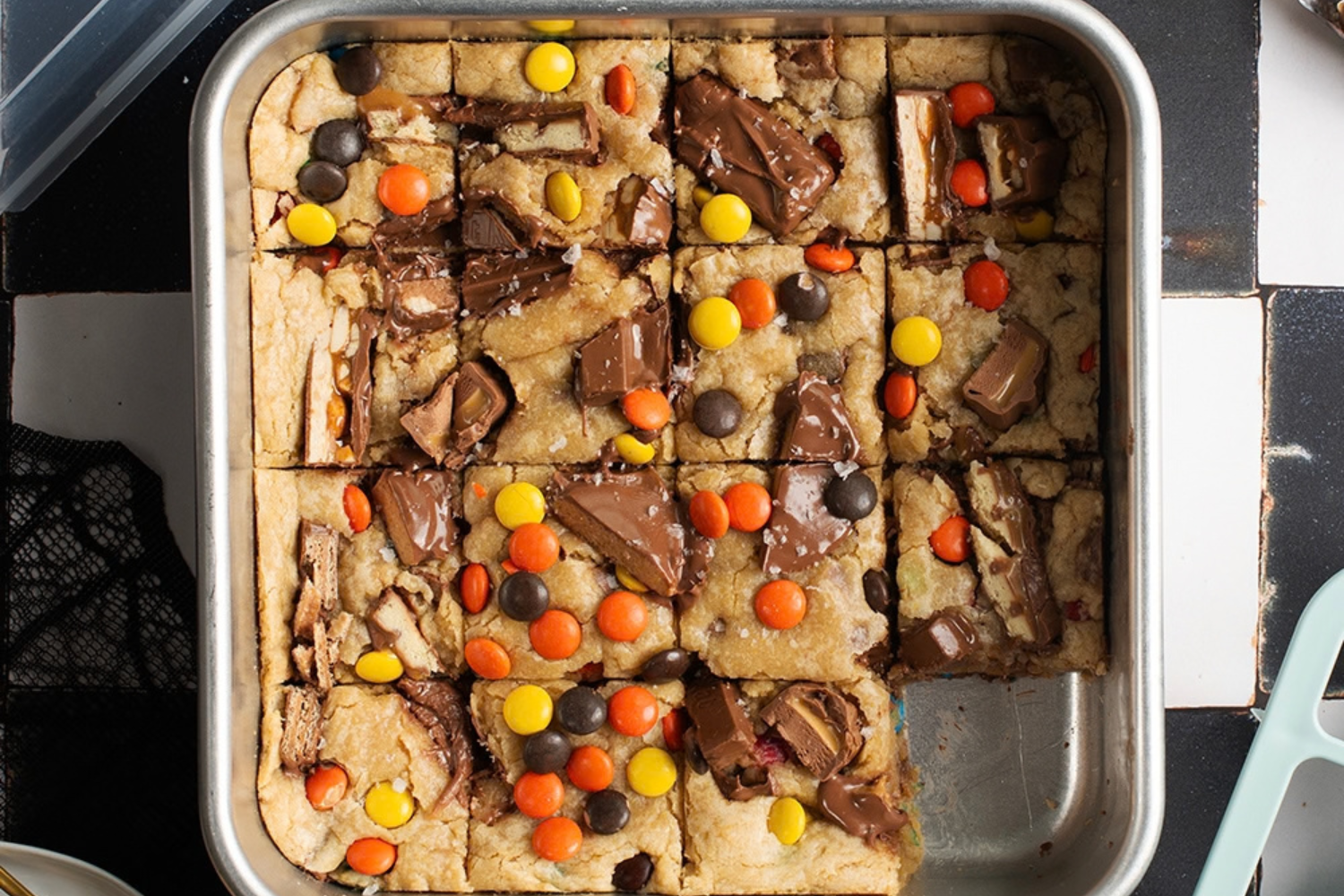 Halloween Candy Cookie Bars baked in the Brownie Buddy Baking Set with one piece missing. 