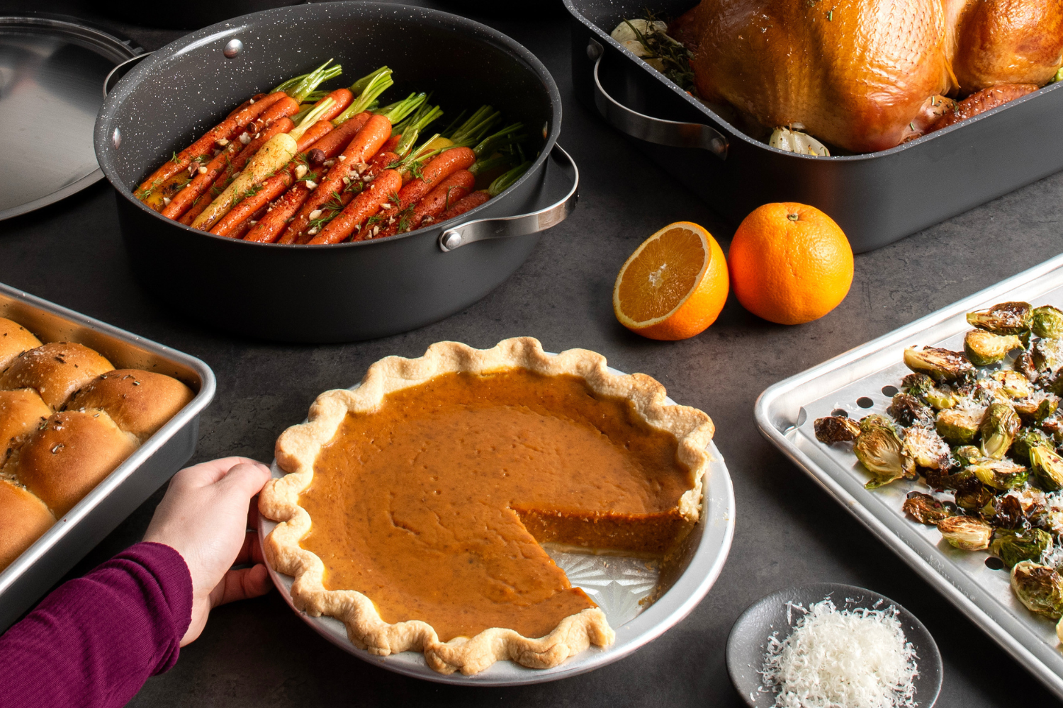 Thanksgiving table featuring a pumpkin pie made in the Naturals® Vintage Starburst 9 Inch Pie Pan