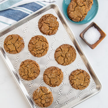 Star-shaped gingerbread cookies baked golden brown on Nordic Ware aluminum Naturals Vintage Starburst half sheet pan
