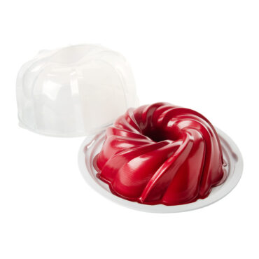 Red Nordic Ware aluminum bundt pan with white translucent plastic cake keeper dome