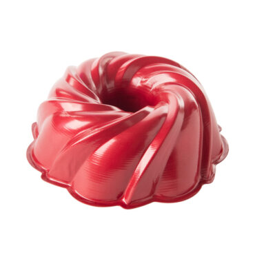 Red Nordic Ware aluminum swirl bundt pan with white translucent plastic cake keeper dome