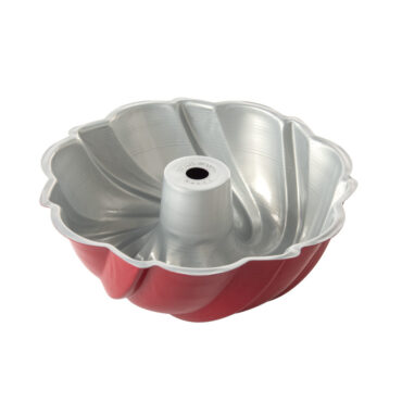 Red Nordic Ware aluminum swirl bundt pan with white translucent plastic cake keeper dome