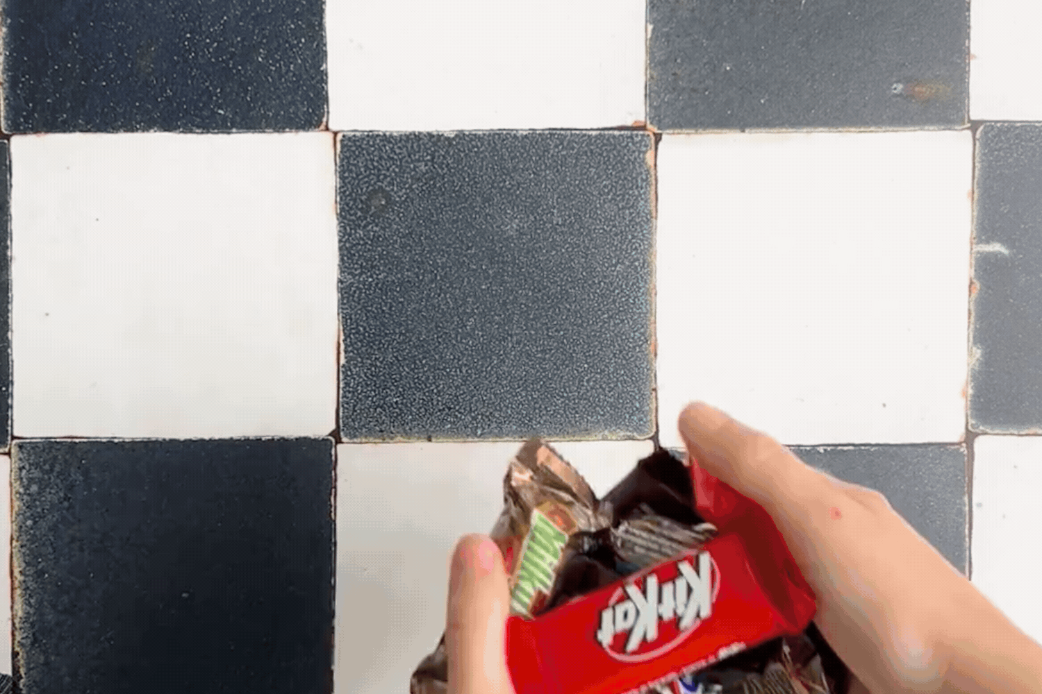 Gif of candy bars being thrown on the counter. 
